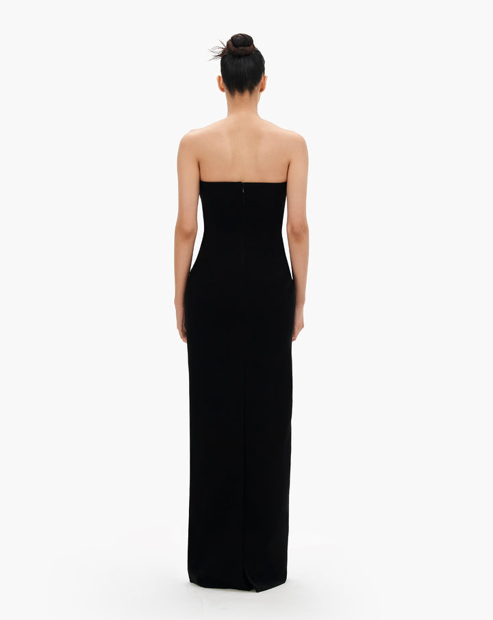 A black column gown with crystal degrade embroidery