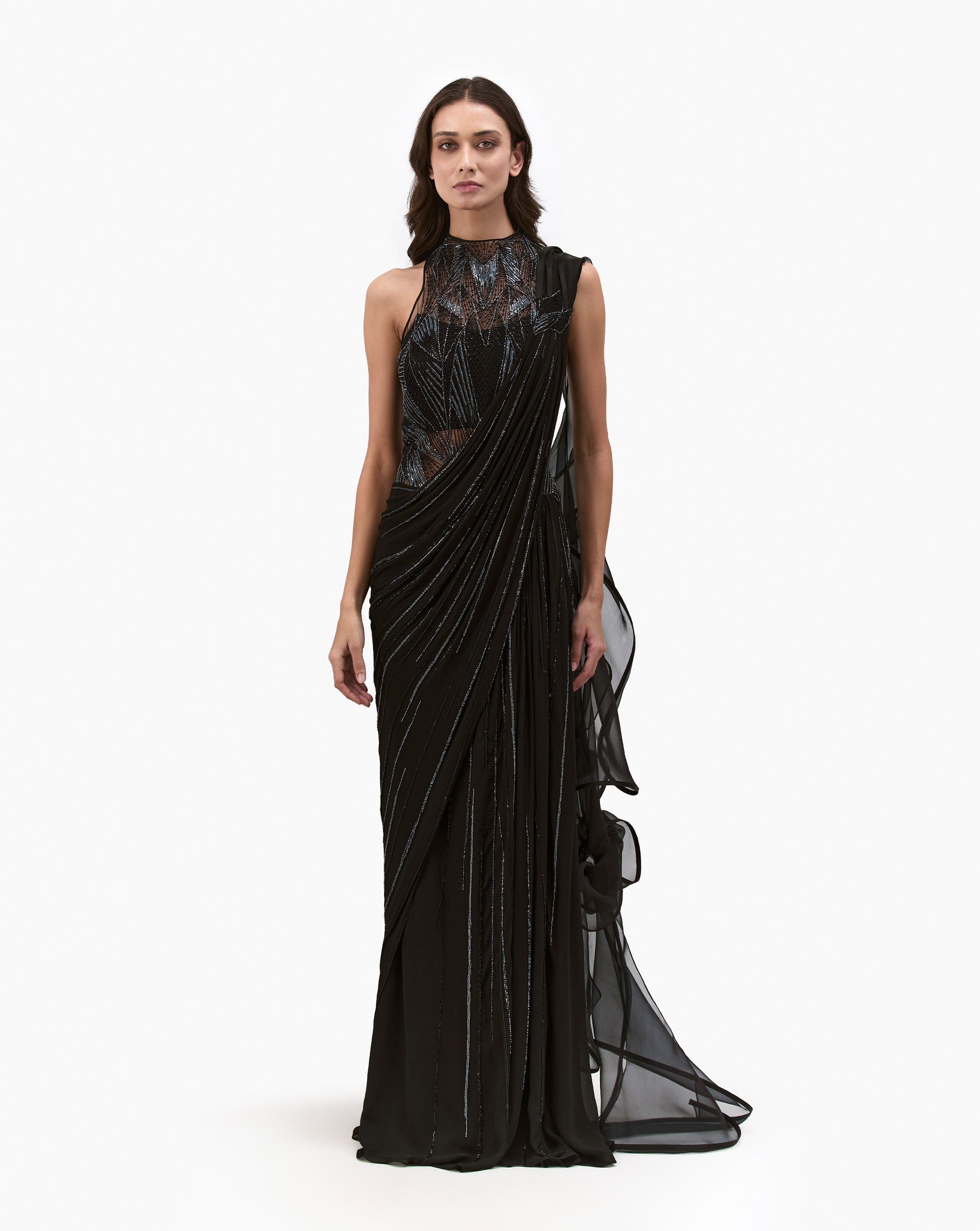 Front look of a model wearing a black dress by Gaurav Gupta